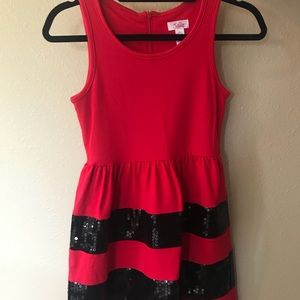 Red dress with black stripes.